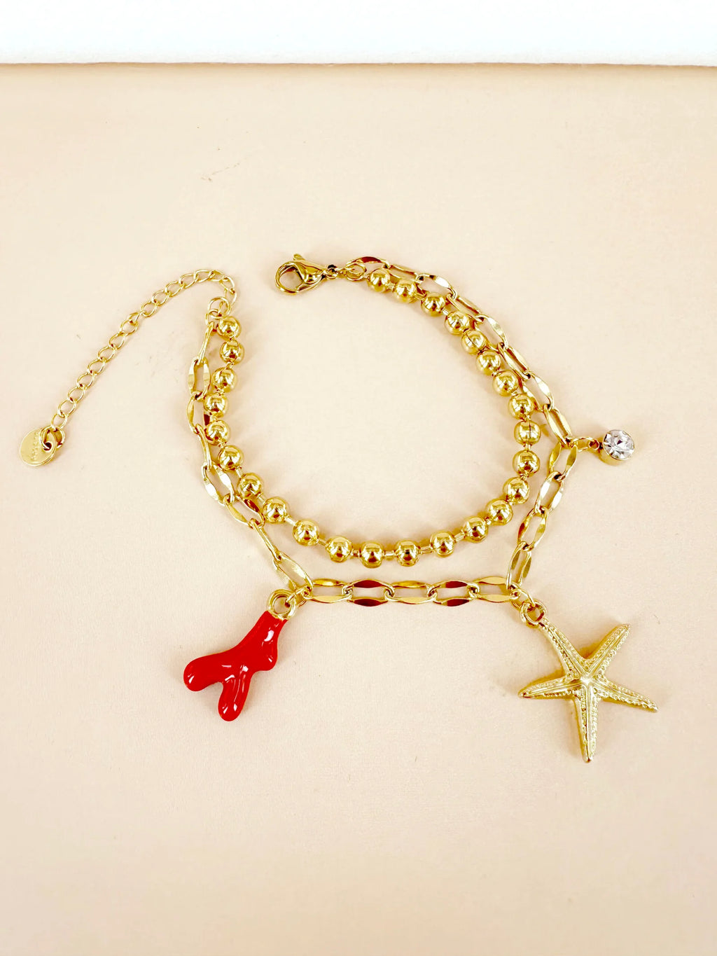 Bracelet breloque étoile de mer et corail rouge: Lucie