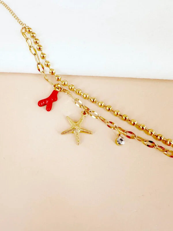 Bracelet breloque étoile de mer et corail rouge: Lucie